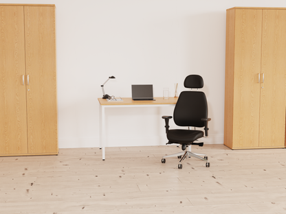 A modern home office setup featuring a black ergonomic office chair.