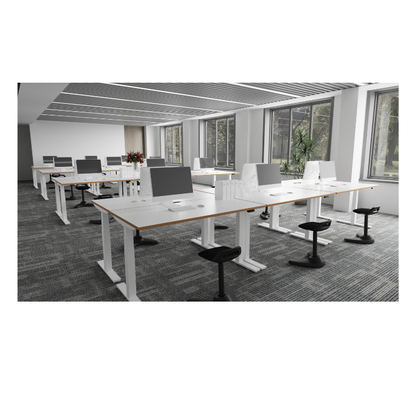 Oslo white standing desks with wood-look tops and black swivel stools in a modern office